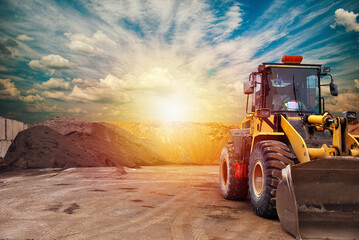 Fototapeta na wymiar Bulldozer loader machine during earthmoving.Heavy equipment machine wheel loader on construction site .