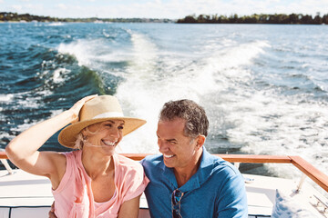 Ocean, happy couple and on a boat for retirement travel, summer freedom and holiday in Bali. Smile,...