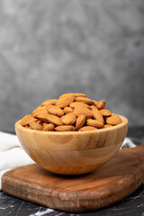 Almond. Organic almond nut in wooden bowl. Superfood, Vegetarian food concept. healthy snacks