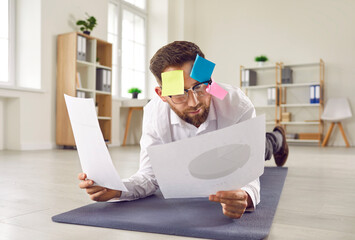 Funny busy businessman multitasking in office. Businessman with sticky post it memo notes on his...