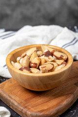 Brazil nut. Brazil nut in wooden bowl. Superfood. Vegetarian food concept. healthy snacks. Close up