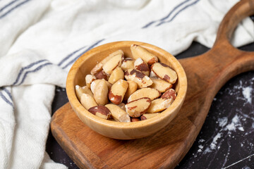 Brazil nut. Brazil nut in wooden bowl. Superfood. Vegetarian food concept. healthy snacks