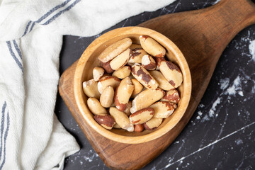 Brazil nut. Brazil nut in wooden bowl. Superfood. Vegetarian food concept. healthy snacks. Top view