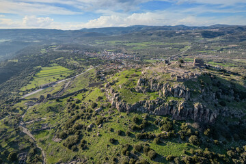 Fototapeta premium The Temple of Athena ruin in Assos Ancient City. Panoramic view Drone shots. Canakkale, Turkey.