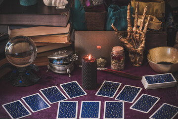 Tarot cards and candles, witch magic bottles . Wicca, esoteric, divination and occult background...