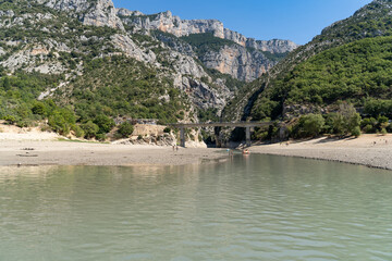 Cause arid weather extreme shallow river in the mountains in southern France. Environmental issues. Drought and tourism