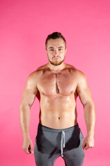 Fototapeta premium Young handsome guy on a diet. A man with a beautiful athletic body. 