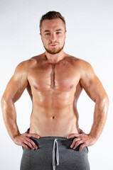 Obraz premium Young handsome guy on a diet. A man with a beautiful athletic body. 