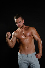 Fototapeta na wymiar Young handsome guy on a diet. A man with a beautiful athletic body. 