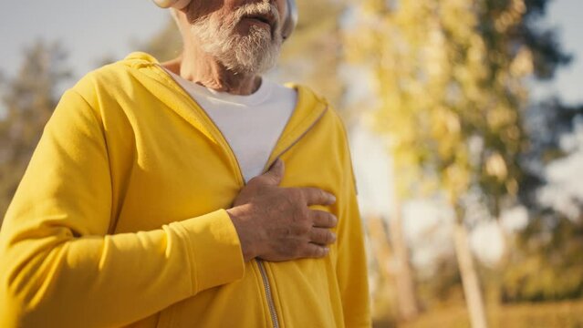Man in his 60s feeling heart ache while doing sports, senior health problems