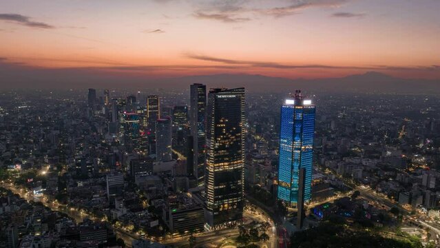 Aerial timelapse of sunrise in Mexico City skyline morning in Reforma avenue