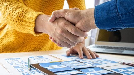 Close-up ux developers and ui designers use augmented reality to brainstorm on mobile app interface...