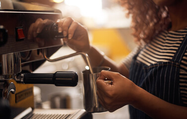 Coffee machine, hands and barista steam milk in cafe for latte, espresso and cappuccino drinks. Closeup of waitress, jug and hot beverage for heating in caffeine process, restaurant service and store