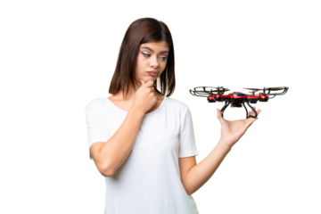 Young Russian woman holding a drone over isolated chroma key background with sad expression