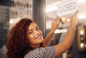 Closed, sign and portrait of happy woman at shop, store and notice of retail shopping time, board and advertisement. Small business owner advertising closing of cafe, information or storefront poster