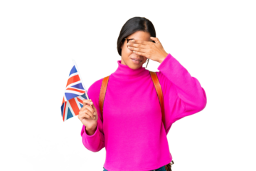 Young African American woman holding an United Kingdom flag over isolated chroma key background covering eyes by hands. Do not want to see something