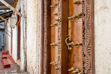 City of Stone Town Zanzibar, Tanzania Island capital with the historic wooden doors