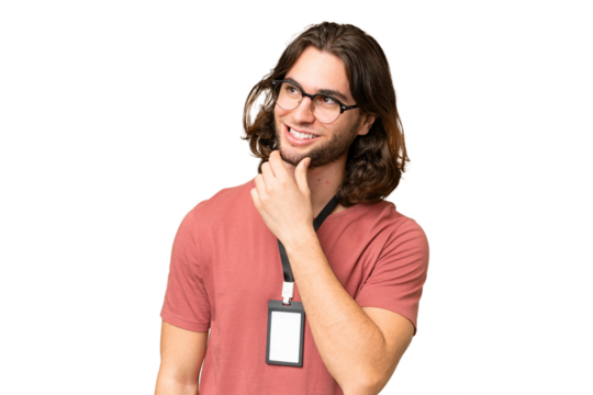 Young handsome man with ID card over isolated background looking to the side and smiling
