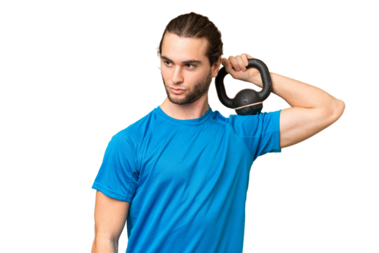 Young handsome man isolated on green chroma background making weightlifting with kettlebell