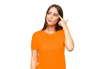 Young pretty caucasian woman over isolated background making the gesture of madness putting finger...