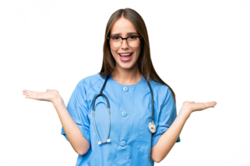 Young nurse caucasian woman over isolated background with shocked facial expression