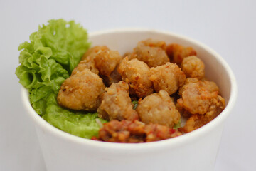 A rice bowl with a green leafy salad
