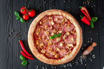 Tasty and big pizza with different types of meat