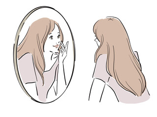 鏡を覗き込むロングヘアの女性