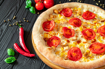 Tasty and big pizza with different types of meat