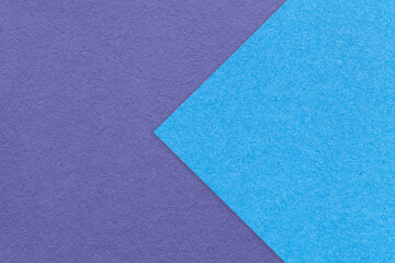 Fototapeta na wymiar Texture of violet paper background, half two colors with blue arrow, macro. Structure of craft very peri cardboard.