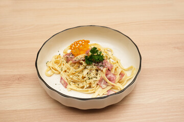Spaghetti Carbonara, with eggs, parmesan cheese and cream sauce. Traditional Italian cuisine.
