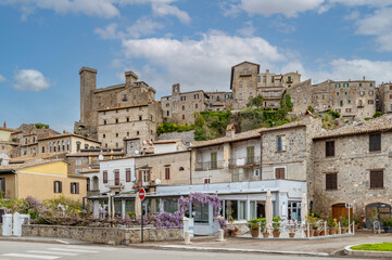 A glimpse of Bolsena, Italy, dominated by the Rocca Monaldeschi della Cervara