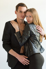 A beautiful young couple - a guy and a girl, fashion models. Couple in love
