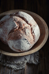 Tasty and healthy loaf of bread with grain and ears.