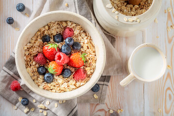 Fresh and sweet oats with berry fruits and seeds.