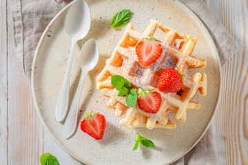 Homemade and fresh wafers with strawberries and mint.