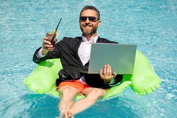Summer business. Freelancer in summer swimming pool. Business man in wet suit in water. Crazy business summer vacation. Funny crazy businessman formal wear in swim pool. Hot business sumer.