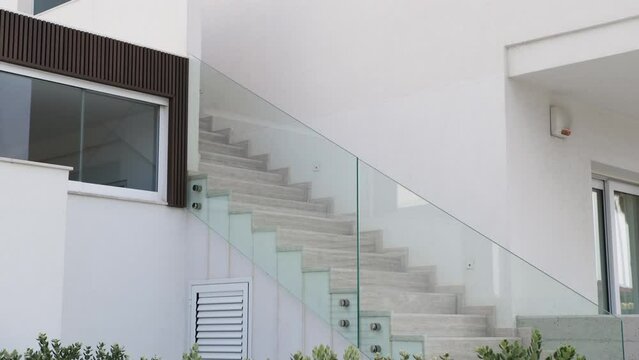 modern house staircase with glass railing
