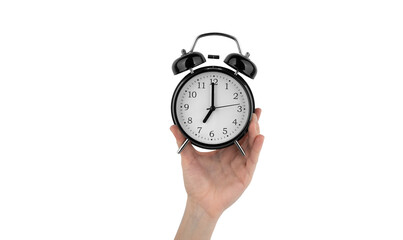 Isolated woman's hand holds a black alarm clock