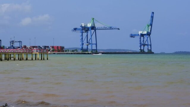 Container port with Nambo beach in the foreground, Kendari, Southeast Sulawesi