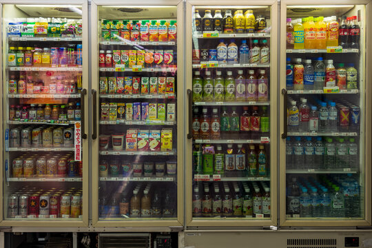 Nagoya, Aichi, Japan - December  2022: Varieties of alcohol drinks, soft drinks in refrigerators at convenience store.