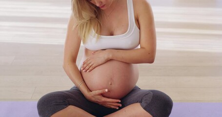 Yoga, rubbing and stomach of pregnant woman for workout, health or exercise. Wellness, pilates and pregnancy with mother and care for belly on floor of home for training, relax or focus on maternity