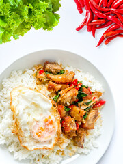 Rice topped with crispy pork belly with Thai basil and fried egg