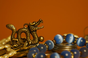 Dragon figurine and jewelry. Religious and spiritual symbol.