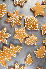 Christmas gingerbread cookies with icing on backing sheet holiday concept