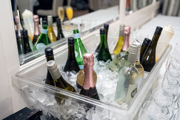 Choice of wine or champagne spirits are on ice and ready for the guest to drink.