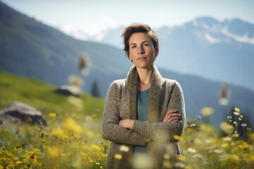 Environmental portrait photography of a satisfied woman in her 30s wearing a chic cardigan against an alpine meadow or mountain wildflowers background. Generative AI - obrazy, fototapety, plakaty