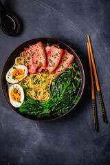 Traditional ramen noodle soup with brisket, spinach and egg.