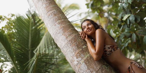 Carefree Young Woman Dreaming in a Tropical Jungle