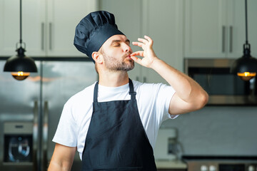 Man chef cooker, baker. Man chefs with sign of perfect food. Chef man cooking, showing sign for...